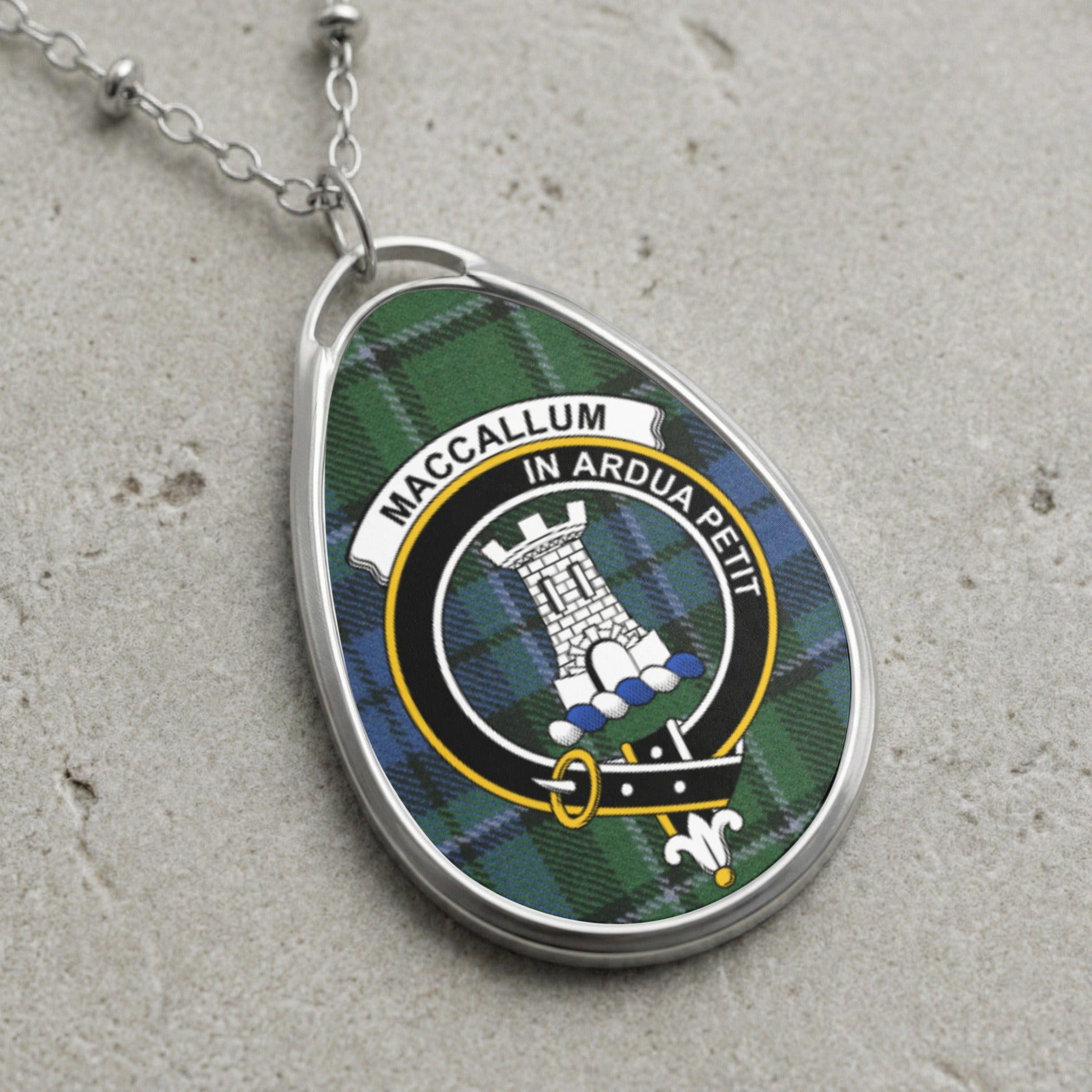 MacCallum tartan oval pendant with clan crest and Latin motto.
