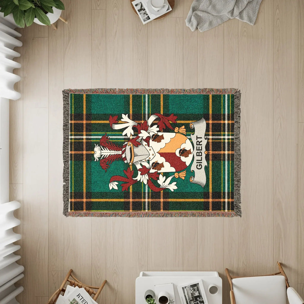 Tapestry rug with Gilbert family crest and green plaid border.