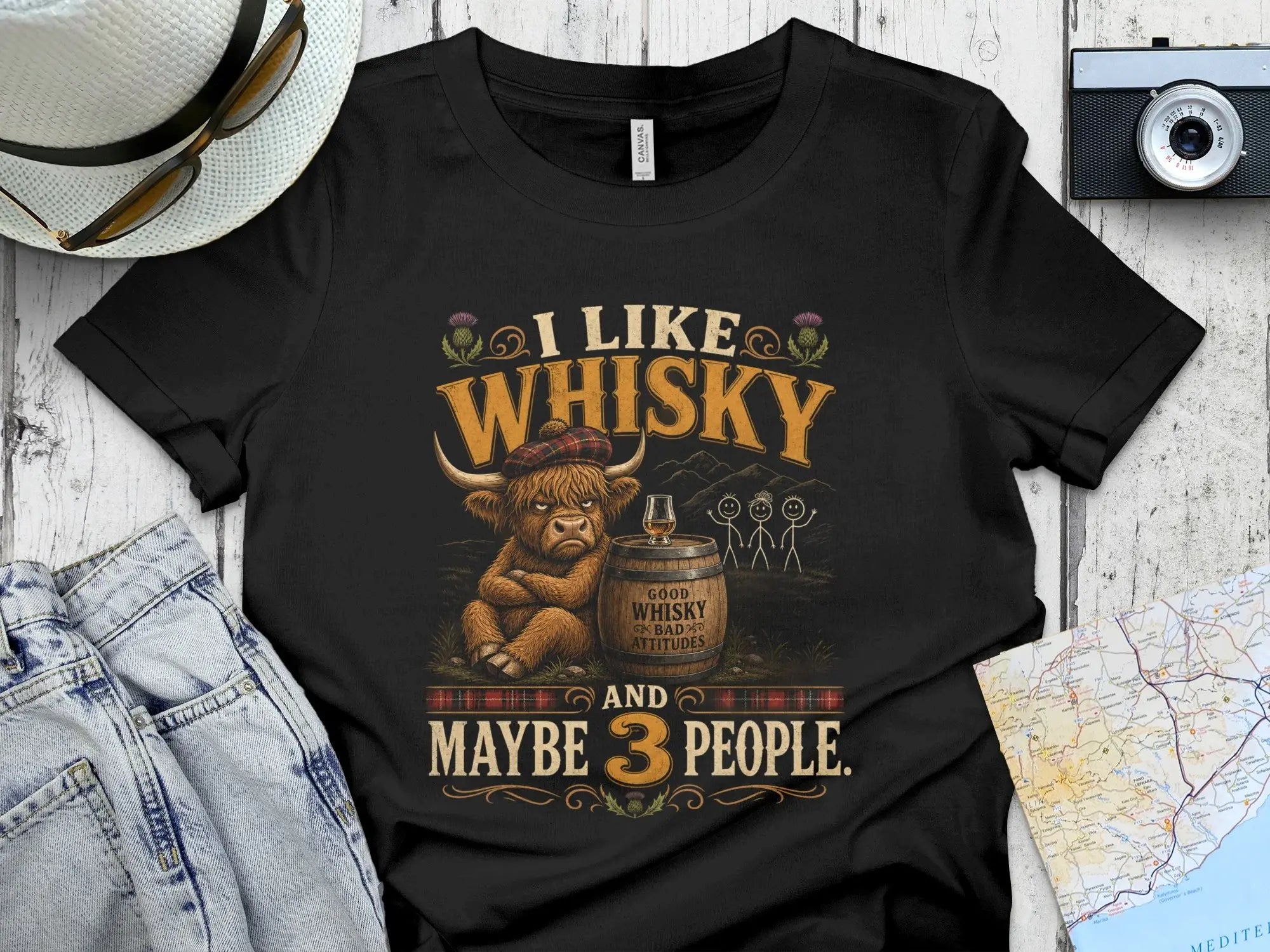 Black t-shirt with Highland cow graphic and text: I like whisky and maybe 3 people.