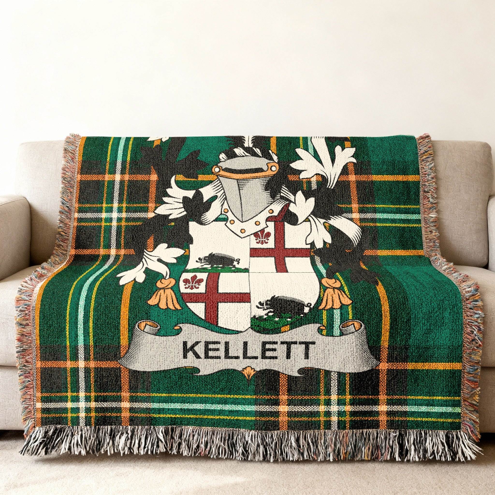 Tartan blanket featuring the Kellett family crest on a couch.