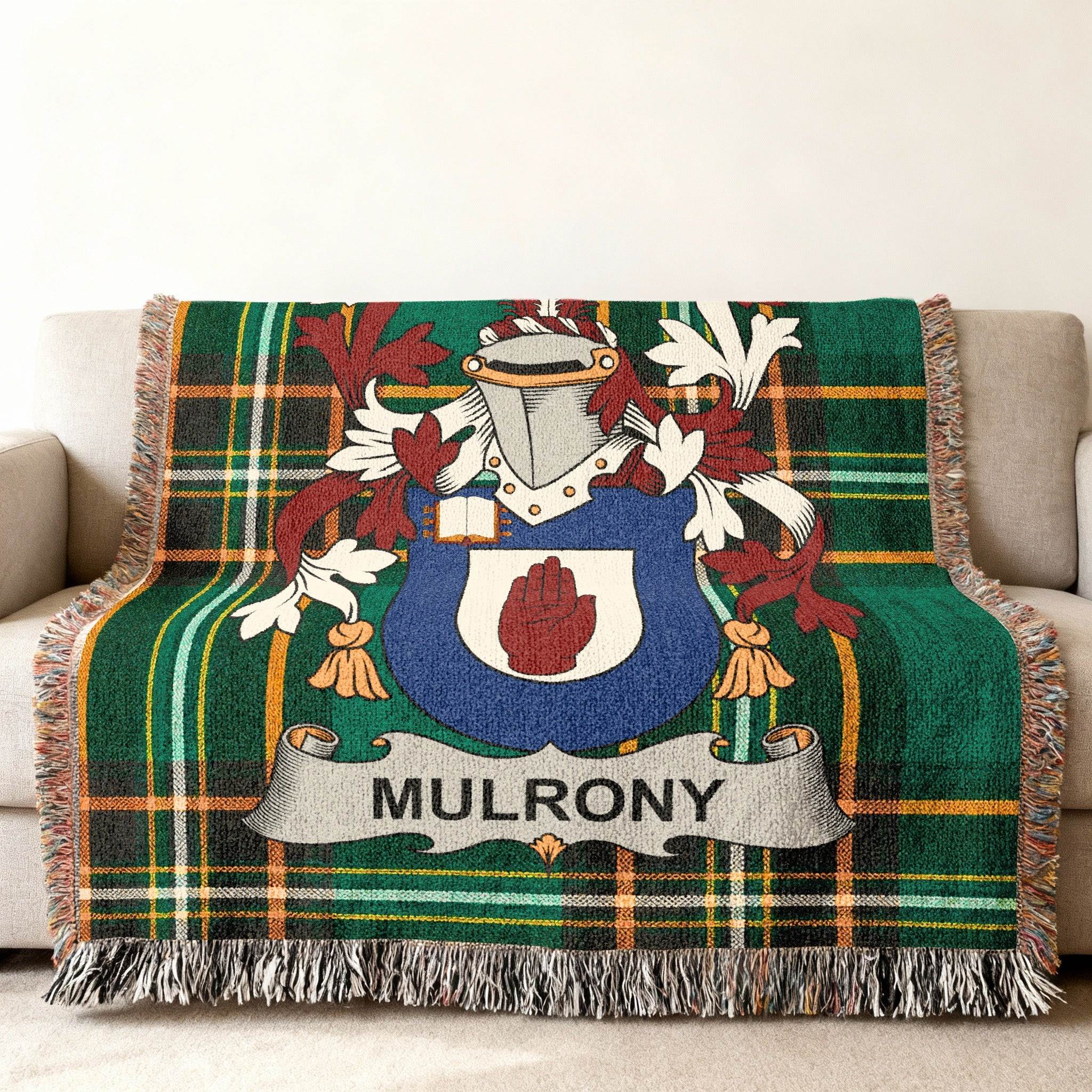 Green plaid blanket with a coat of arms and the name MULRONY.