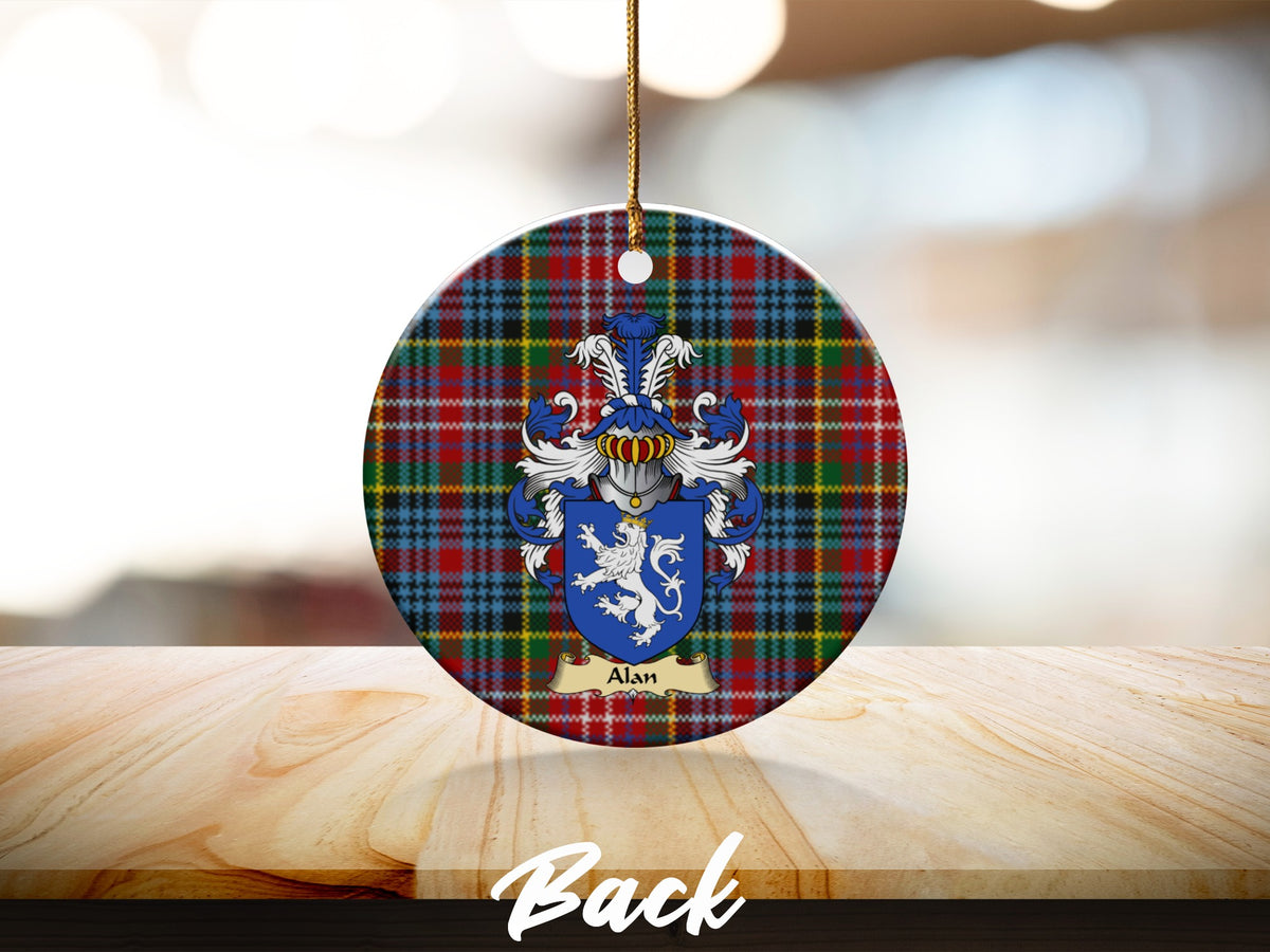 Round Alan Scottish clan ornament with family crest on a Caledonia tartan background