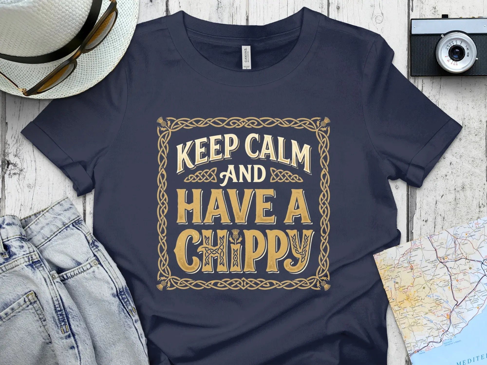 Navy t-shirt with "Keep Calm and Have a Chippy" text in decorative border.