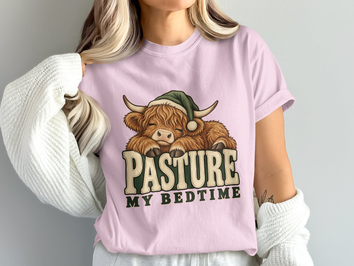 Model wearing the Pasture My Bedtime Highland cow Comfort Colors T-shirt in Blossom