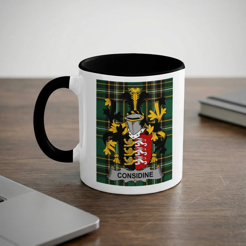 White mug with black rim featuring the Considine family crest on a tartan background.
