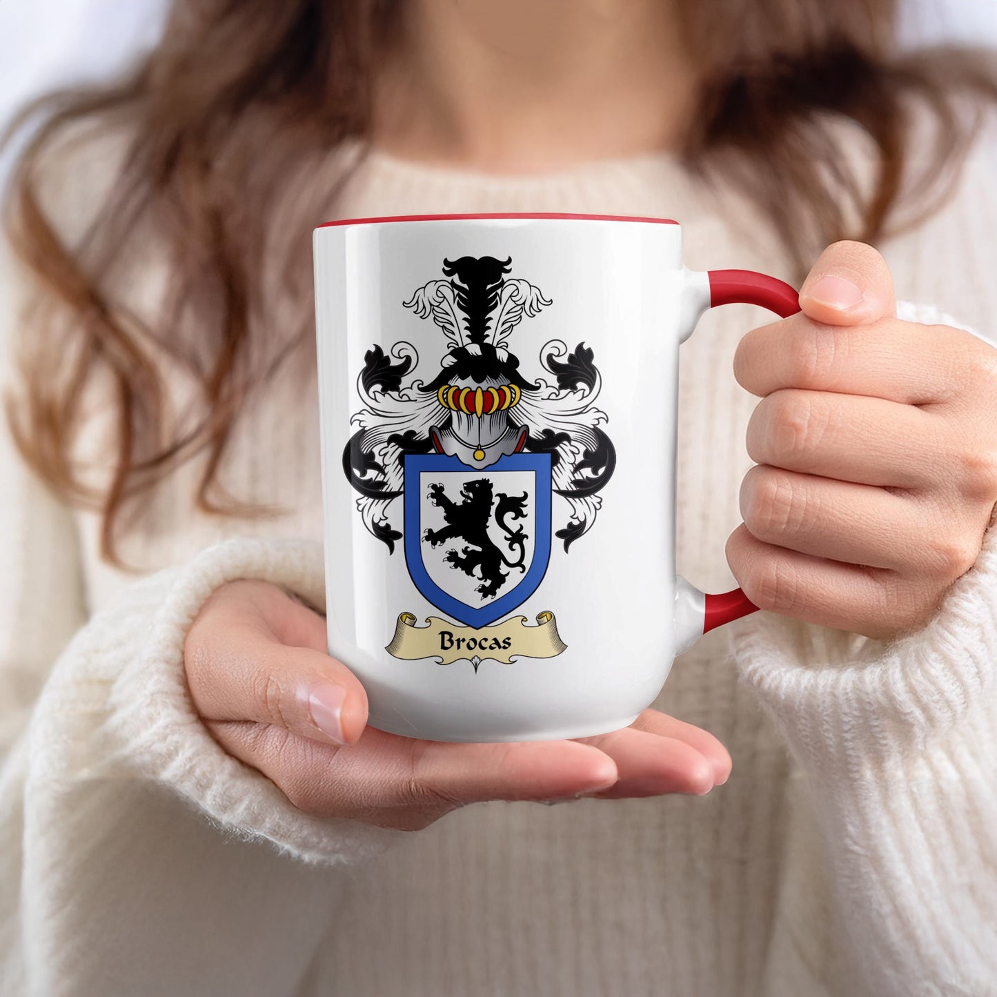 White mug with red handle and rim, displaying the "Brocas" coat of arms.
