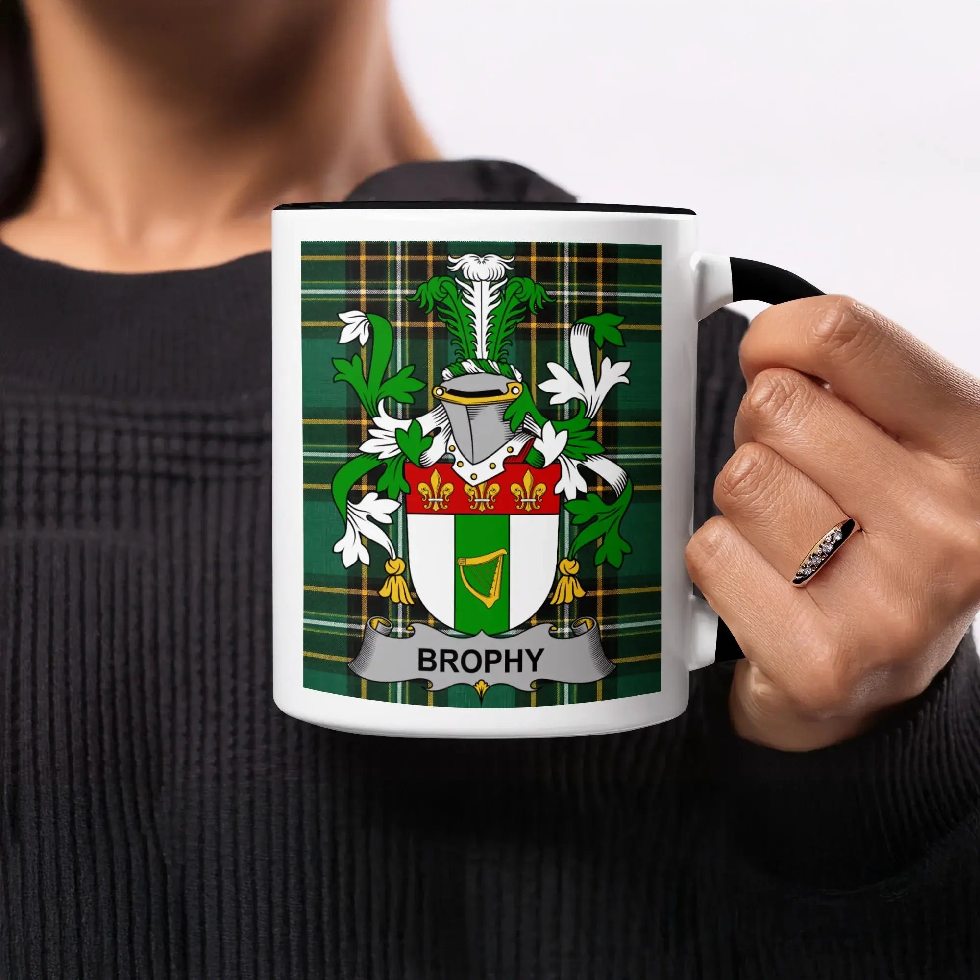 Mug with Brophy family crest on green tartan background.