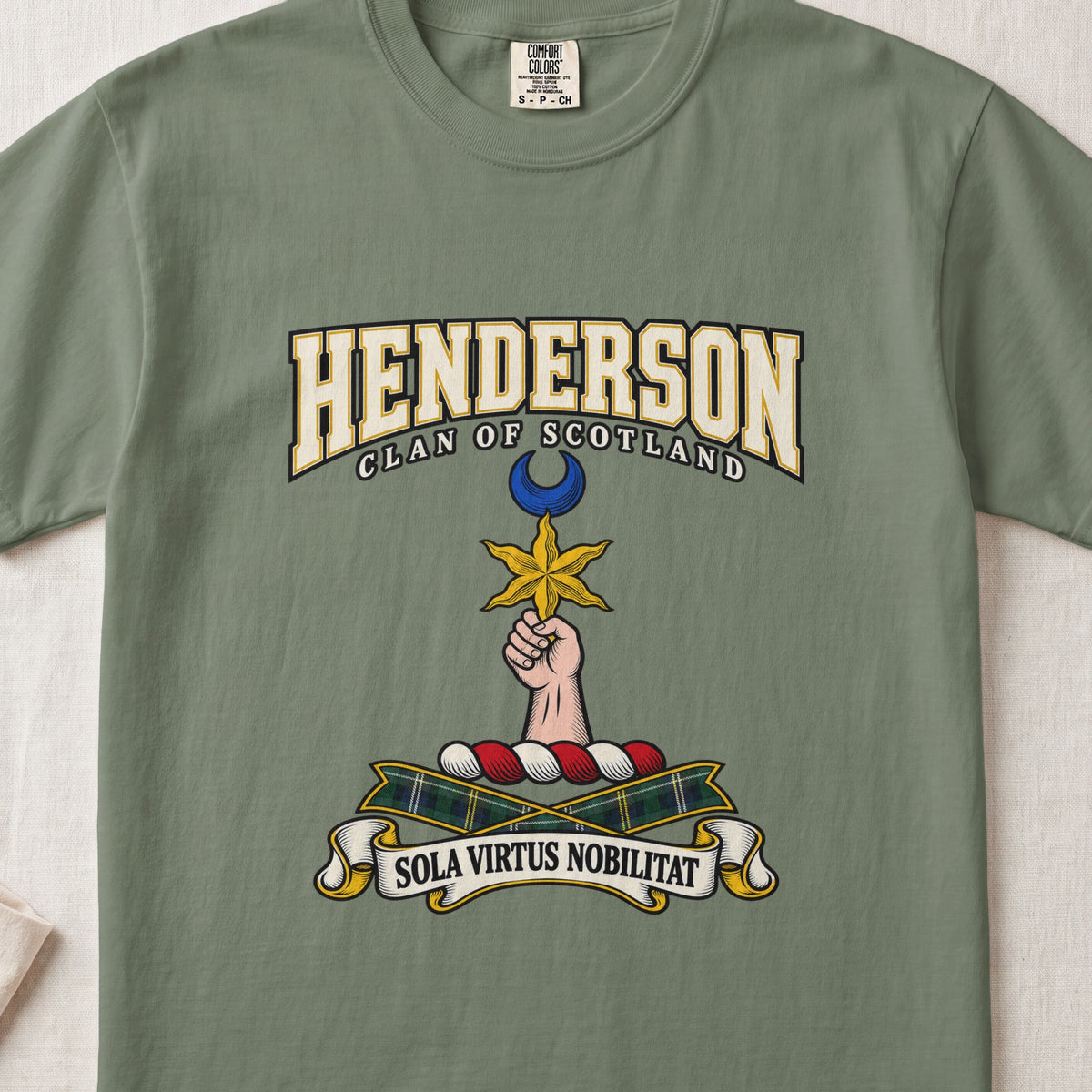Moss Henderson Scottish clan T-shirt, front flat lay with varsity lettering, star-and-crescent crest and tartan ribbon.