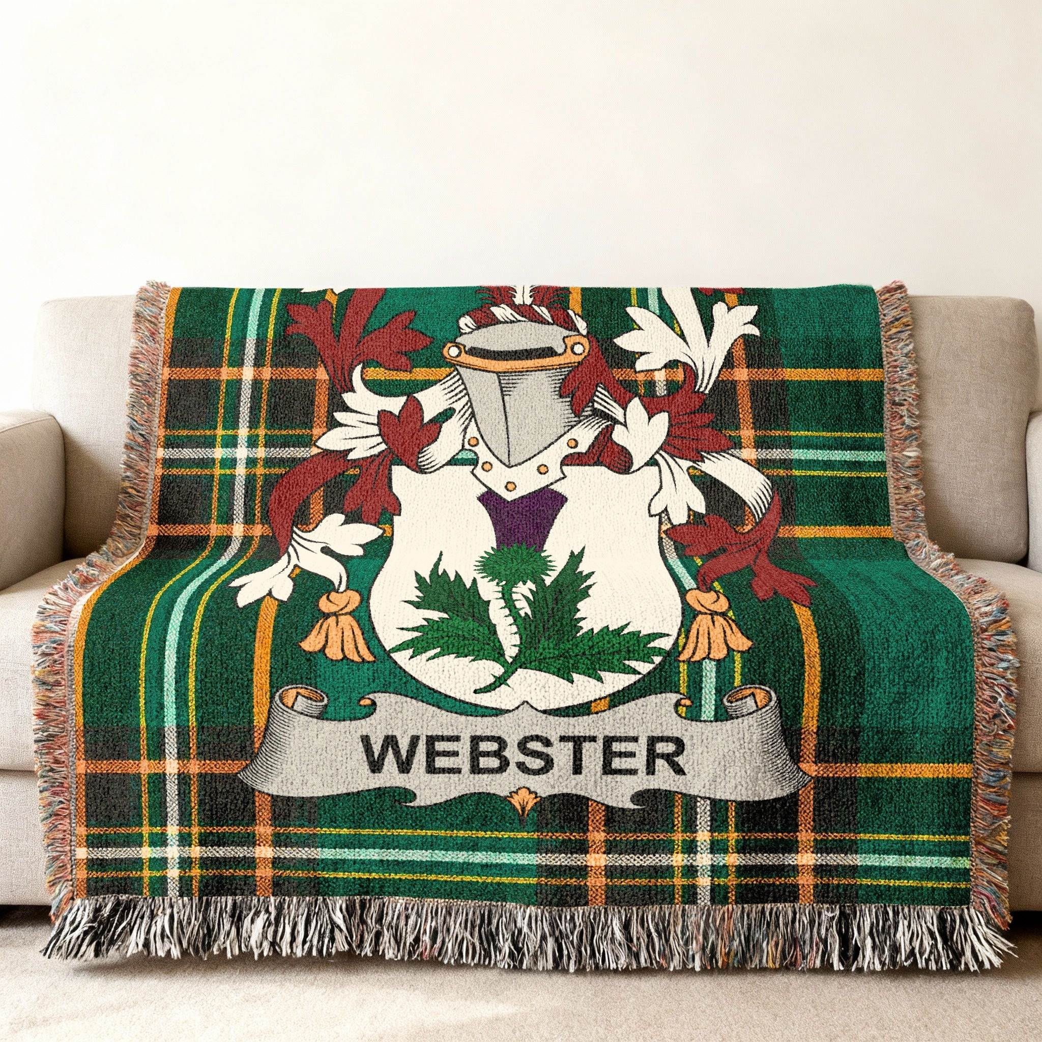 Green tartan woven blanket with Webster family crest.