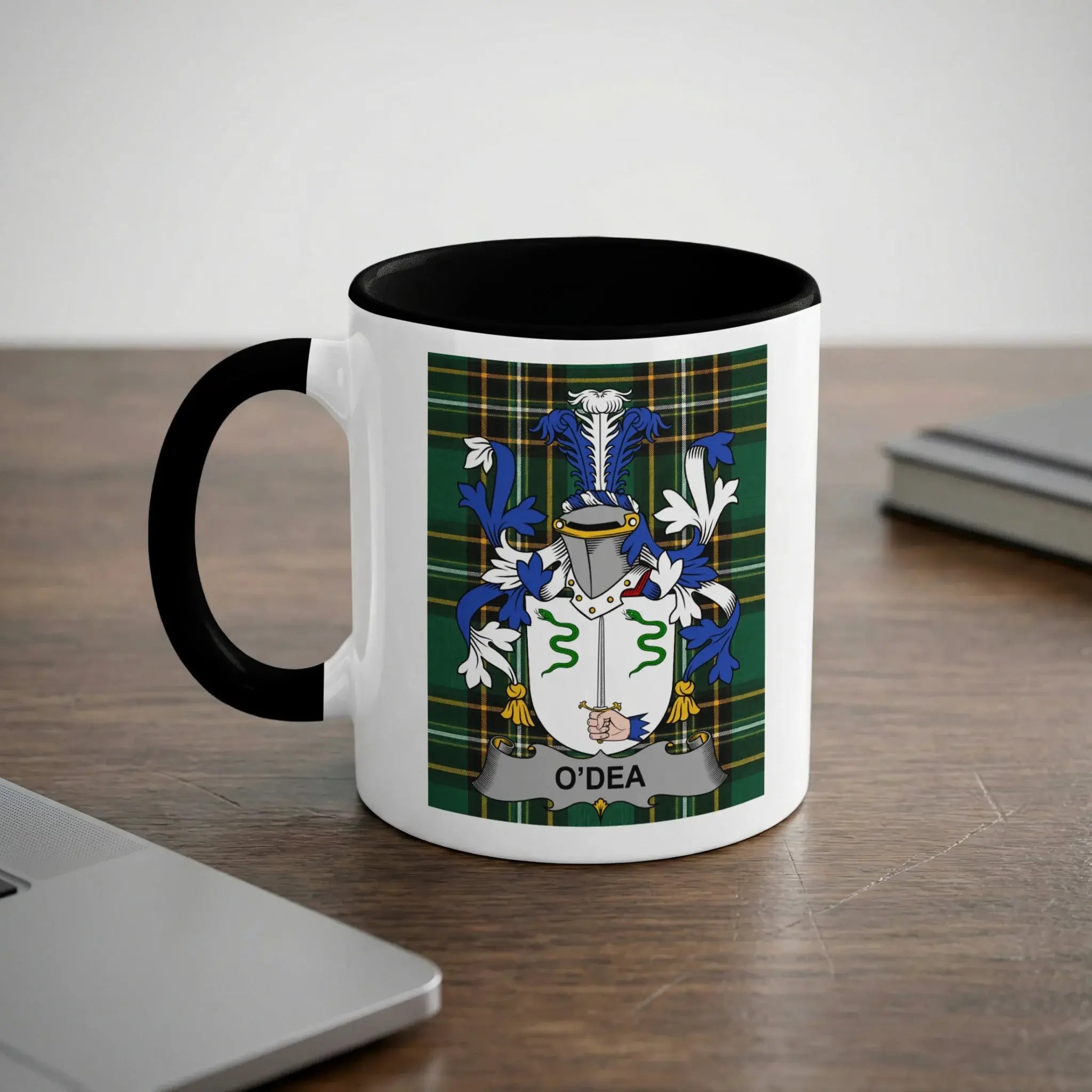 White mug with black handle and interior, displaying the O'Dea family crest.
