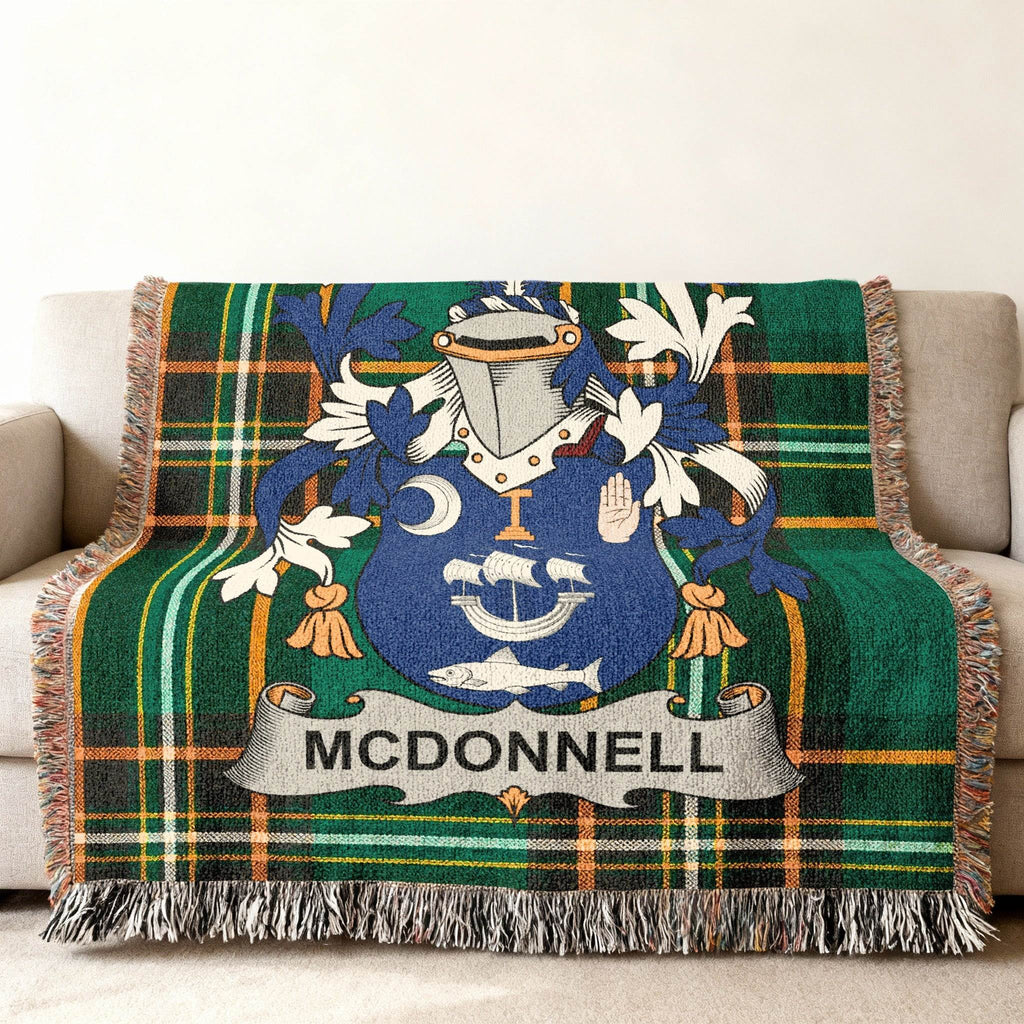 Woven blanket with green tartan and McDonnell family crest.
