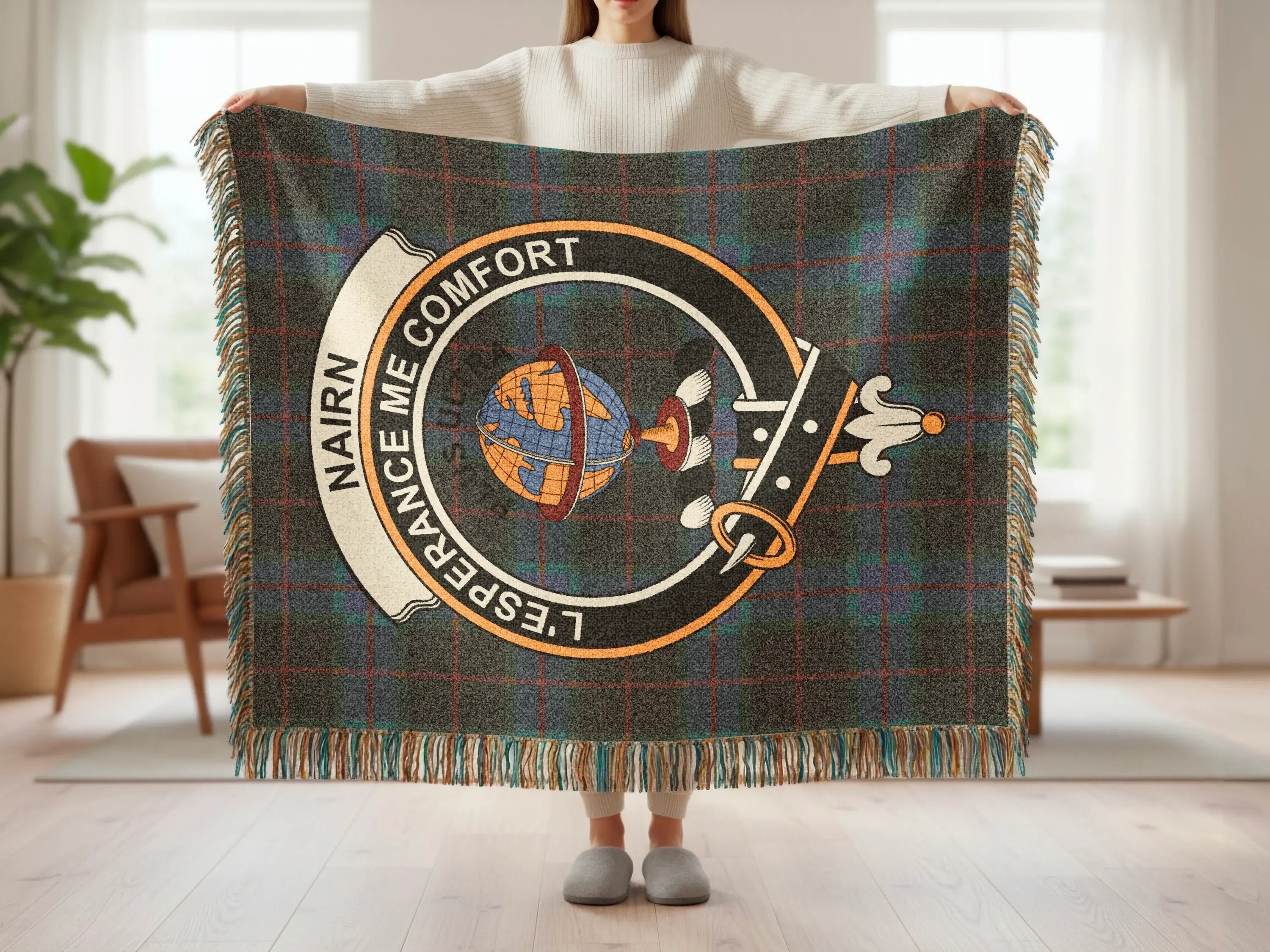 Nairn tartan woven blanket showing clan crest detail — cotton construction with fringe border
