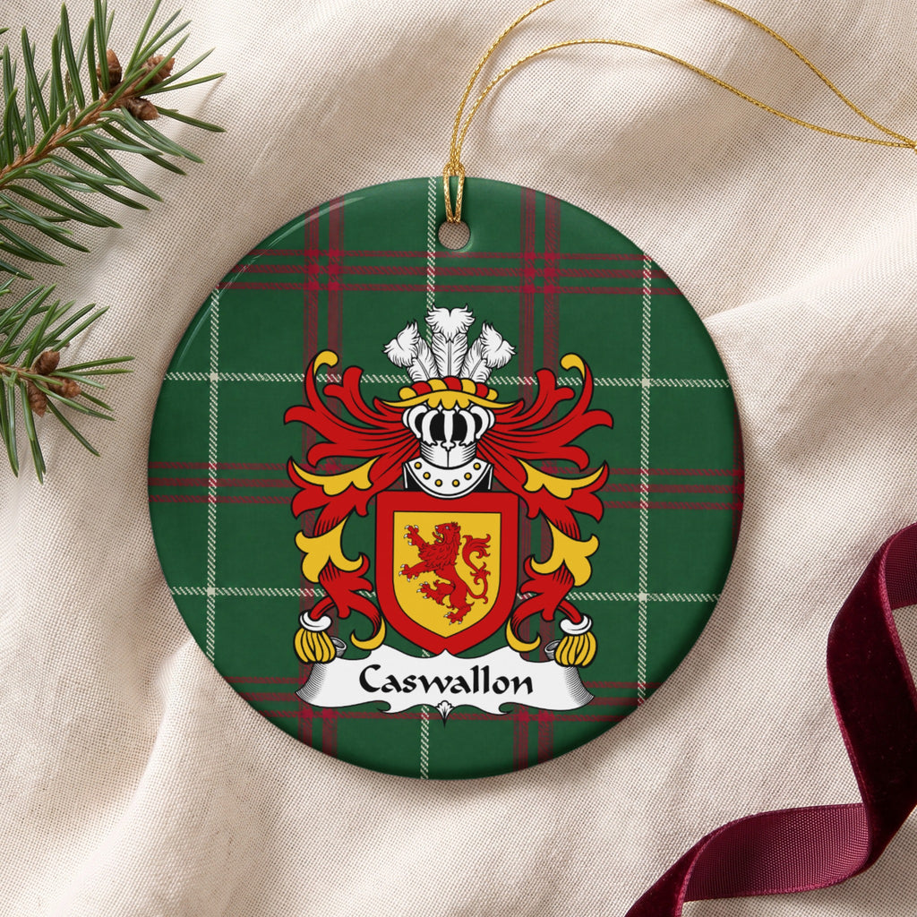 Caswallon ornament on cream fabric with gold string, evergreen and burgundy ribbon; a red upright lion on a gold shield with a red border on Welsh national tartan.