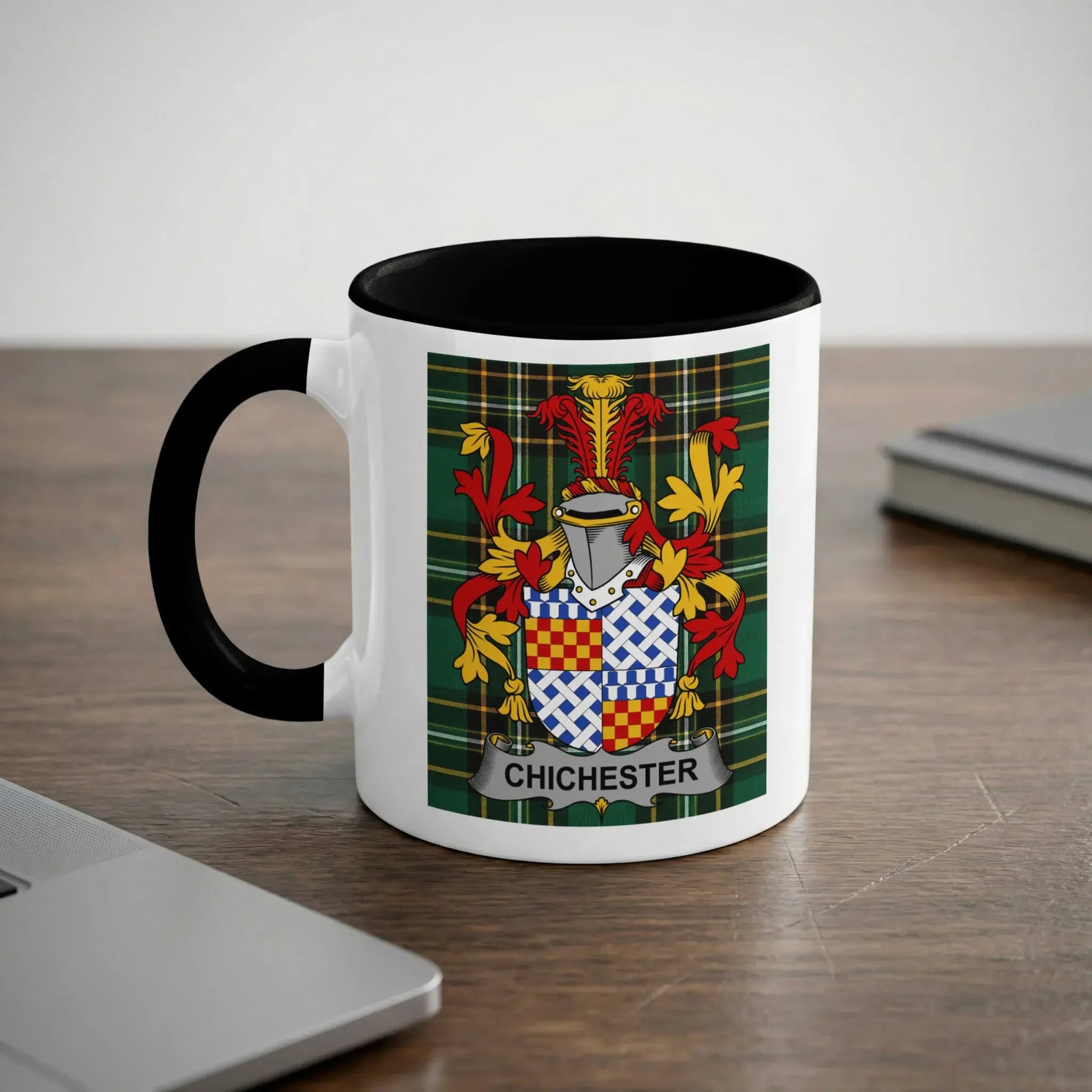 White mug with black handle featuring a family crest with the name "Chichester".