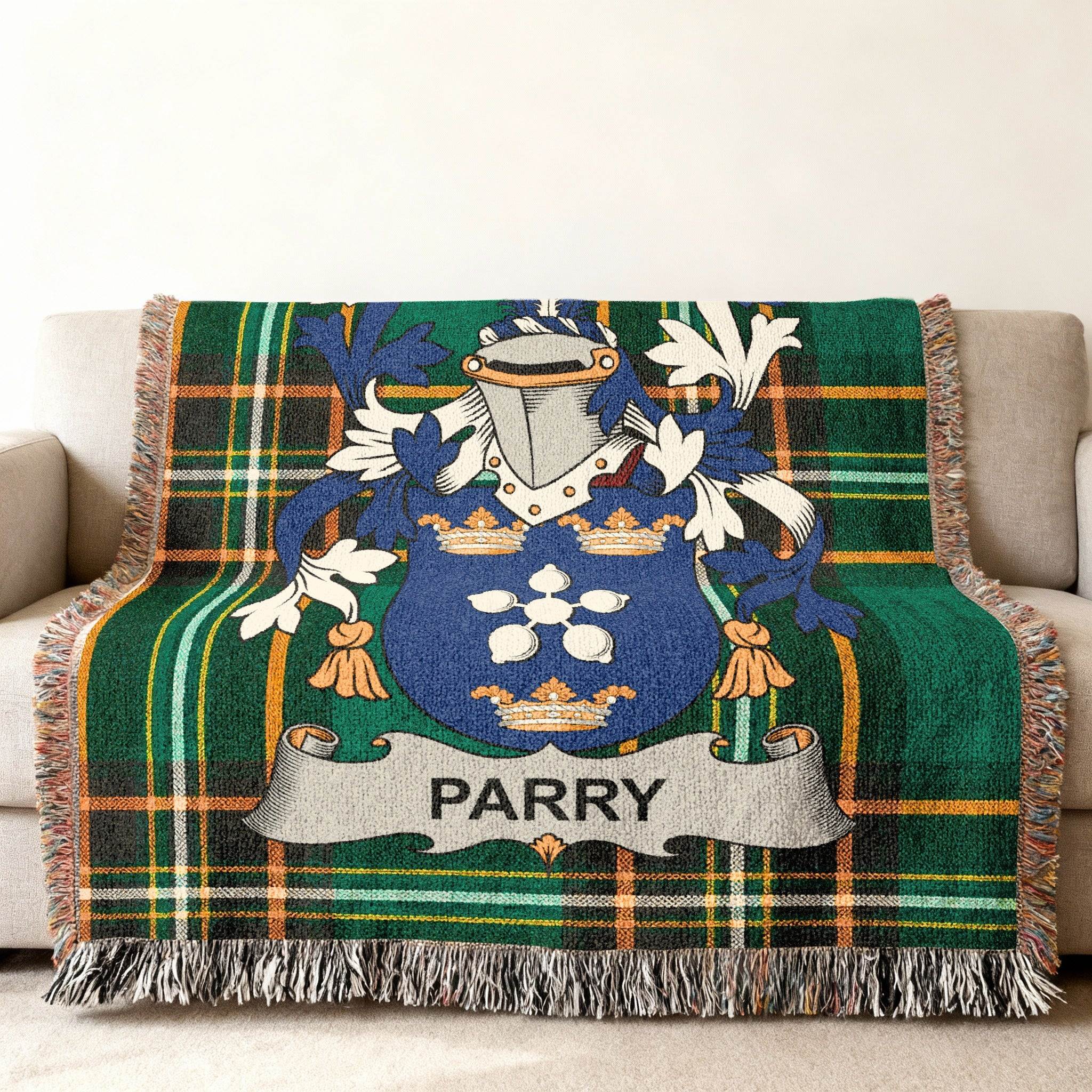 Parry family crest on a green plaid woven throw blanket.