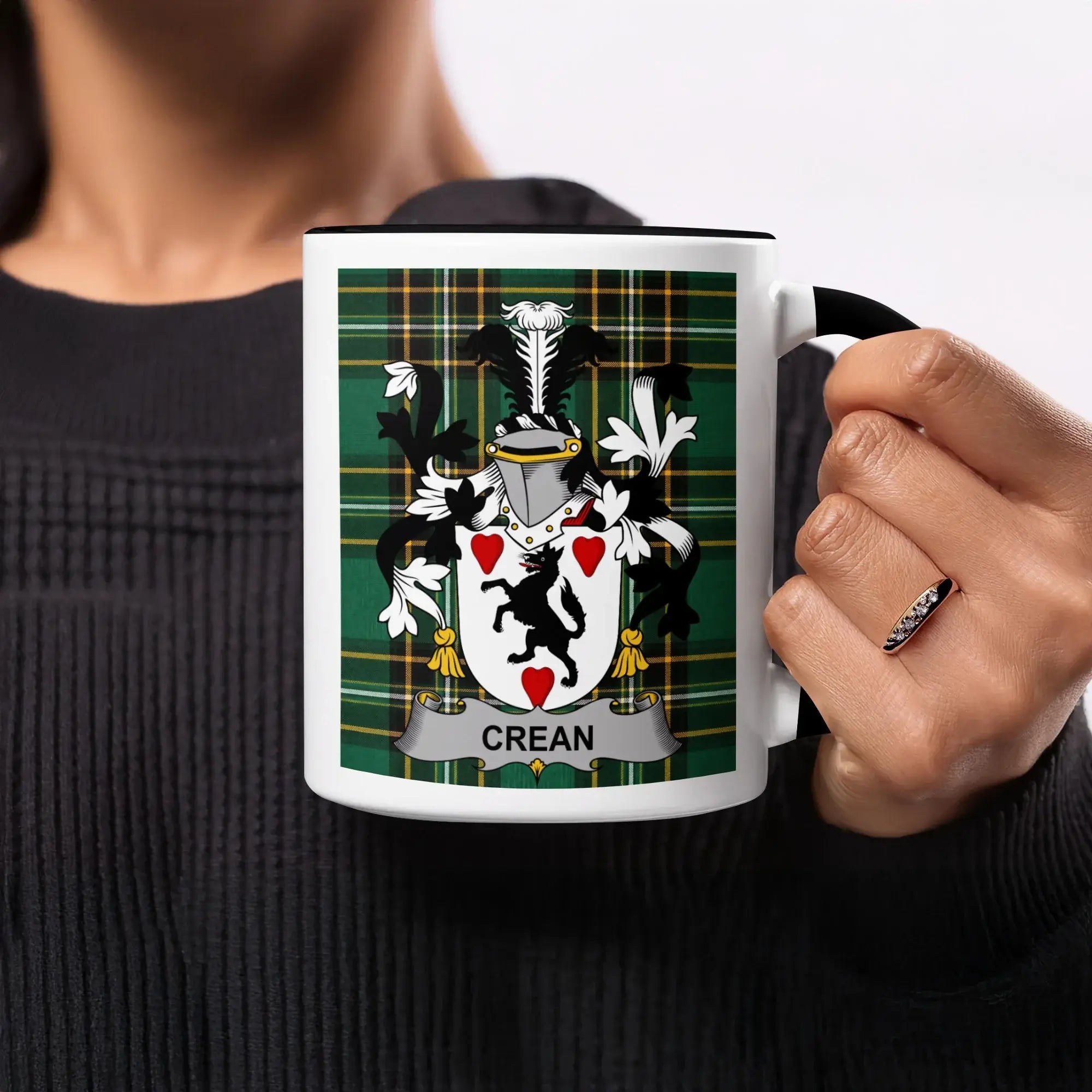 Mug with green tartan background and silver crest with the name "CREAN".