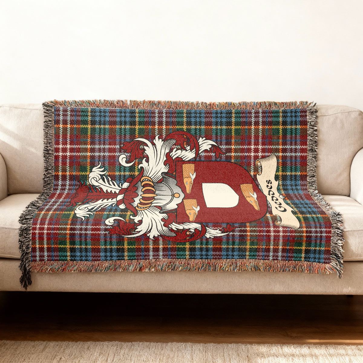Geddes Scottish woven blanket with family shield and Caledonia tartan background