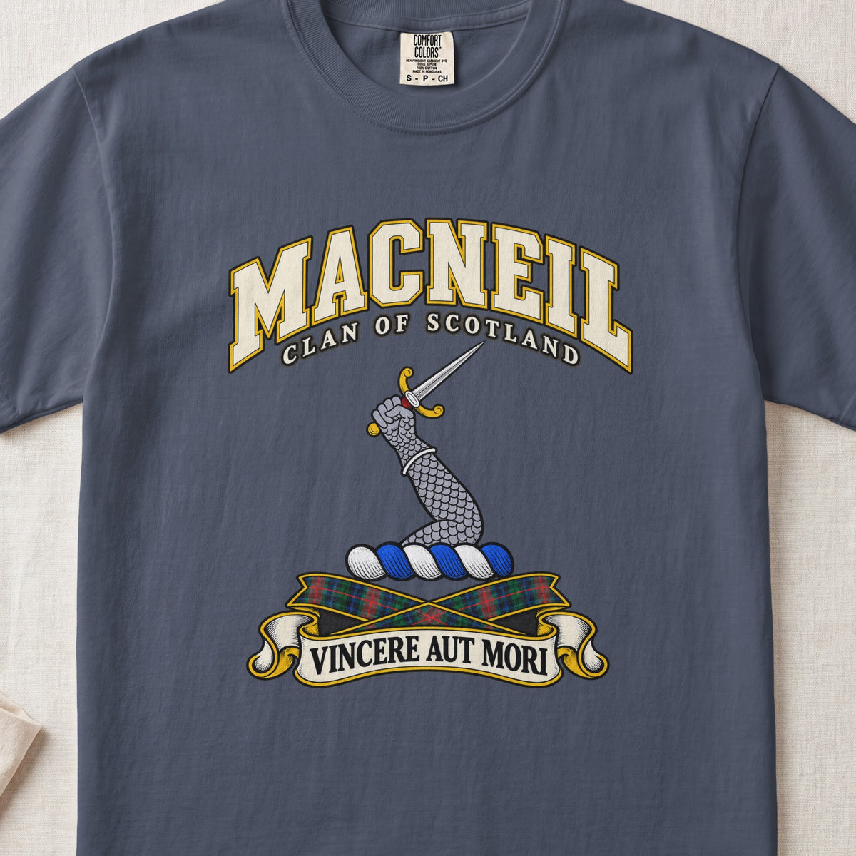 MacNeil Scottish clan T-shirt in Midnight, front view with an armoured arm holding a dagger and motto design.