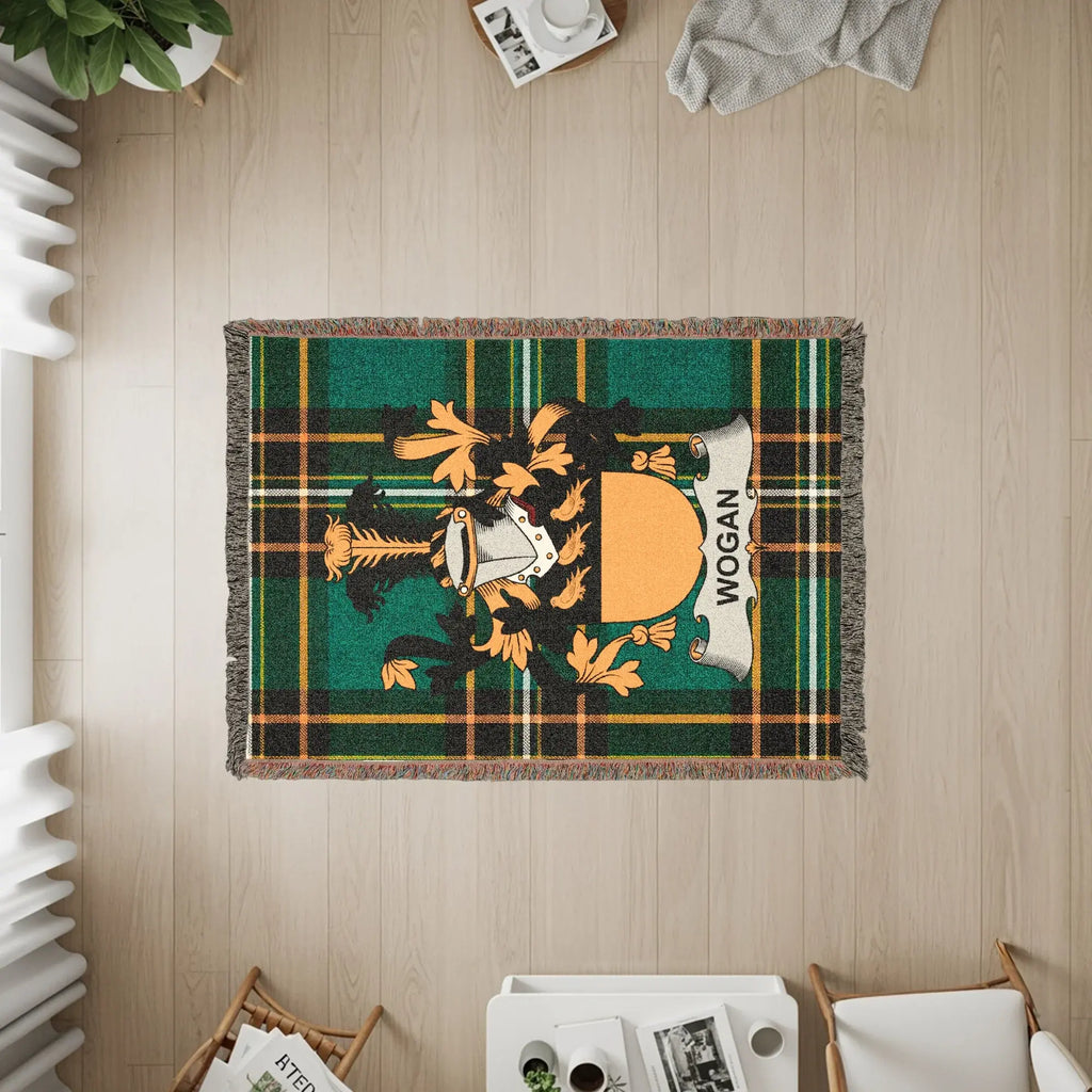 Wogan tartan blanket with crest and fringed edges.