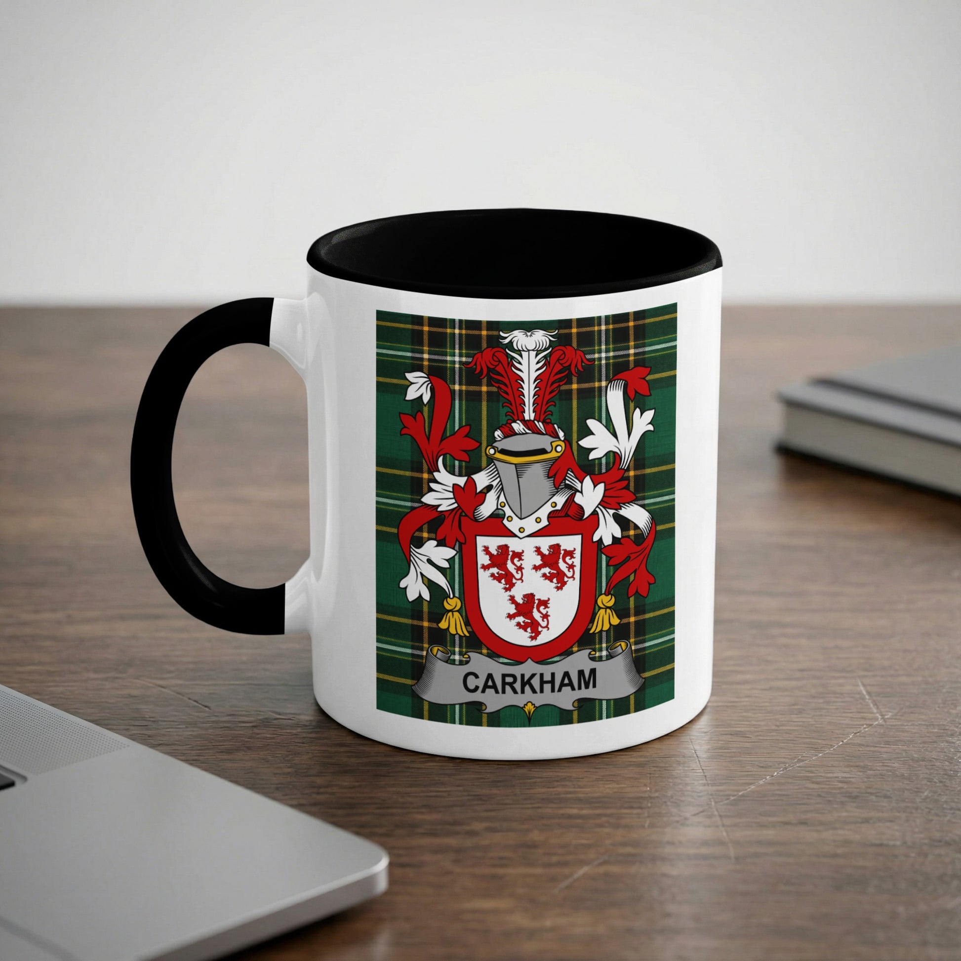 Mug with black handle, featuring the "CARKHAN" family crest on a tartan background.