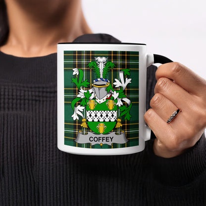 Mug with Coffey family crest on green tartan pattern.
