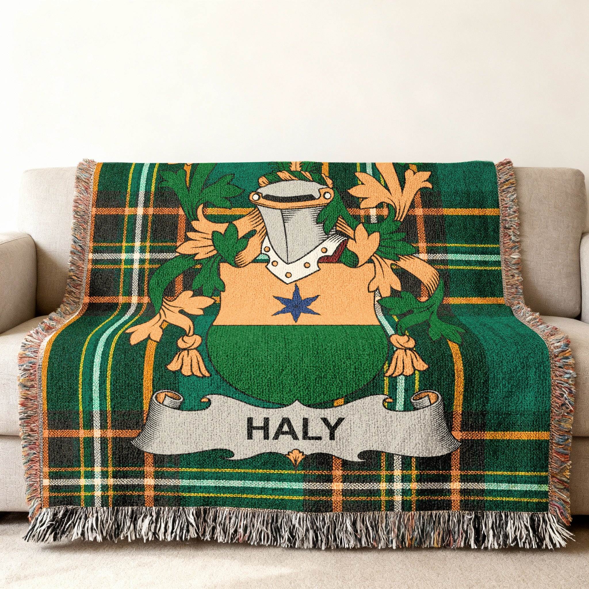 Green tartan blanket with Haly family crest displayed in the center.