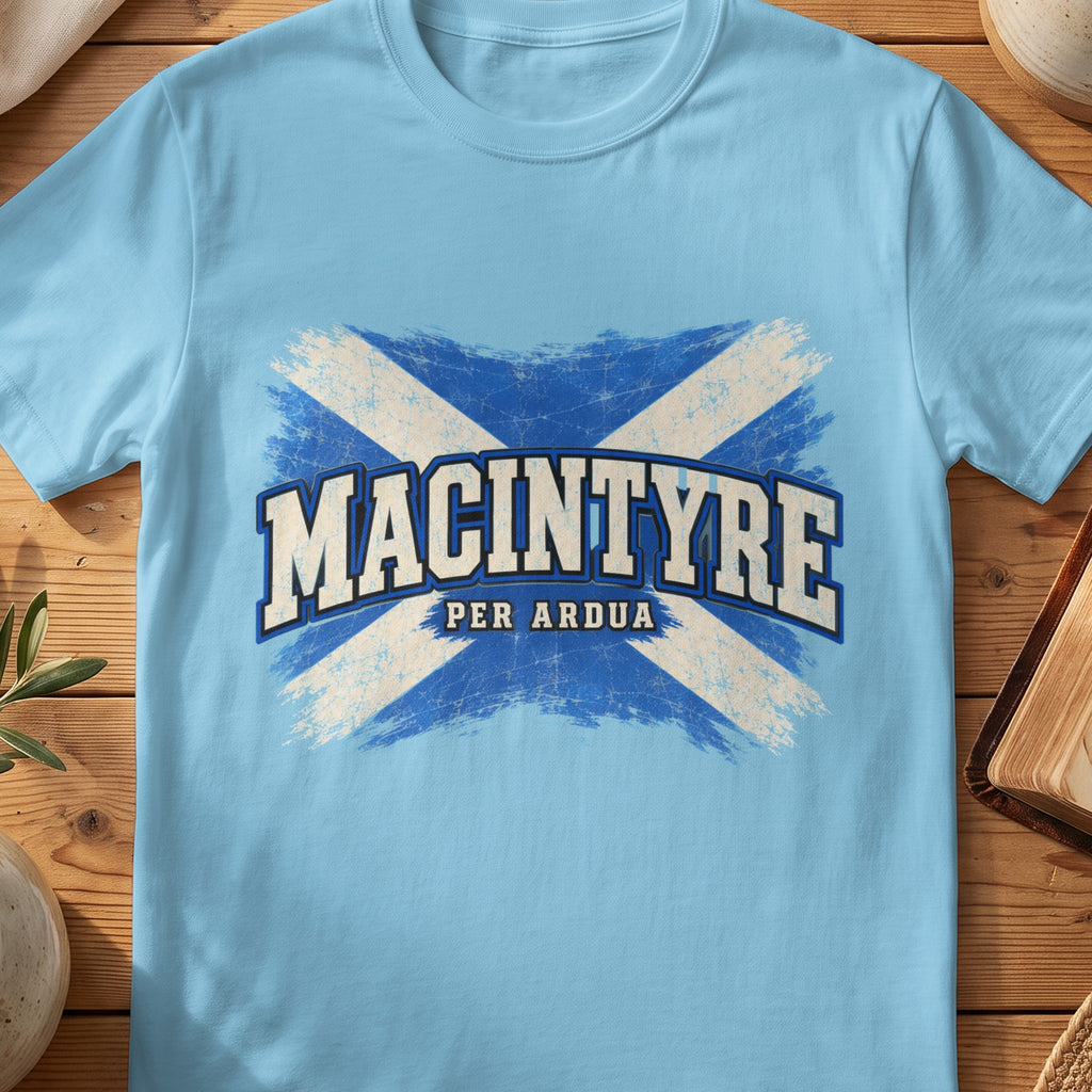 MacIntyre Scottish Saltire T-shirt in Sky, with distressed blue and cream flag and “Per Ardua” lettering.