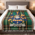 Green plaid blanket featuring the "JEPHSON" coat of arms with a shield and crest.