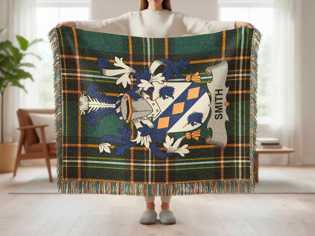 Plaid throw blanket with a coat of arms and "SMITH" text.