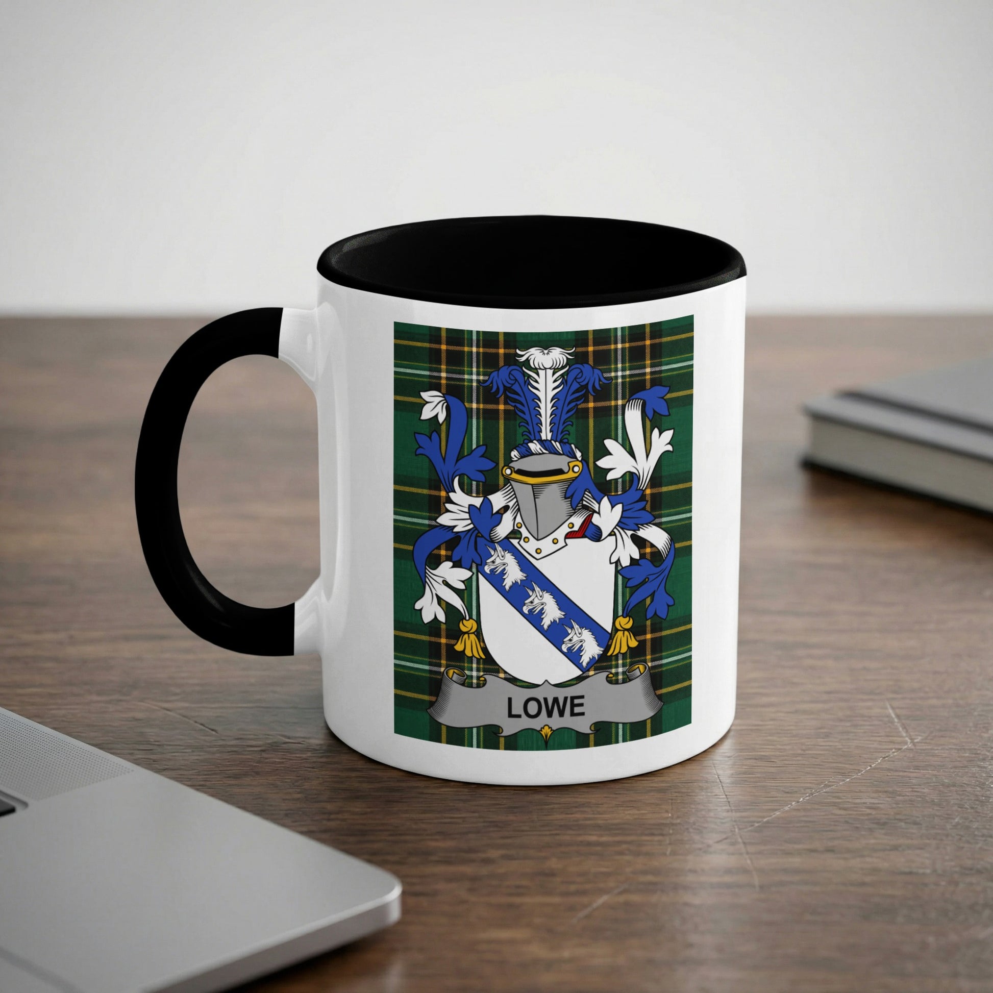White mug with black handle displaying the Lowe family crest.