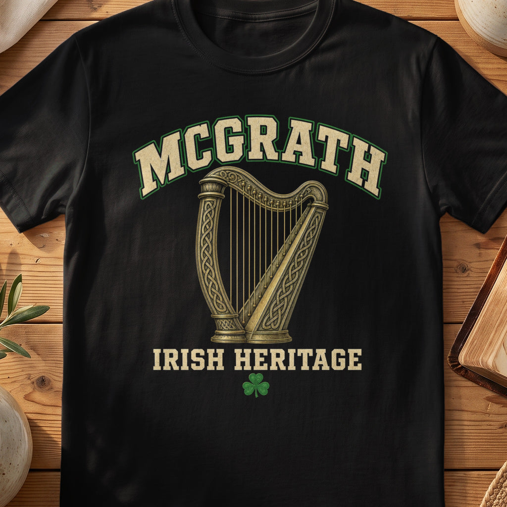 McGrath Irish harp T-shirt in Black, with cream surname lettering, a gold-toned harp, green shamrock and “Irish Heritage” text.