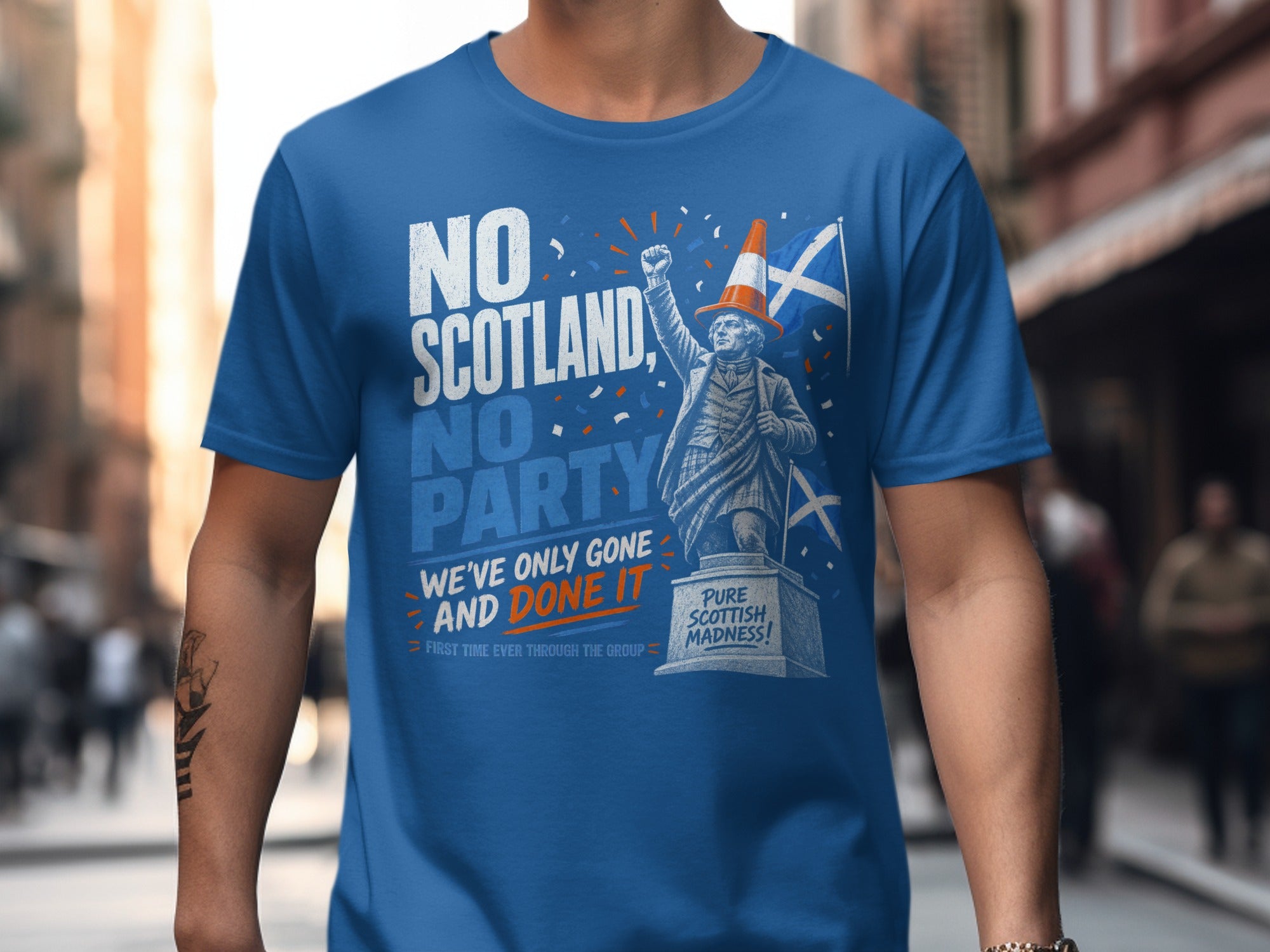 Blue t-shirt with "NO SCOTLAND, NO PARTY" and a statue.