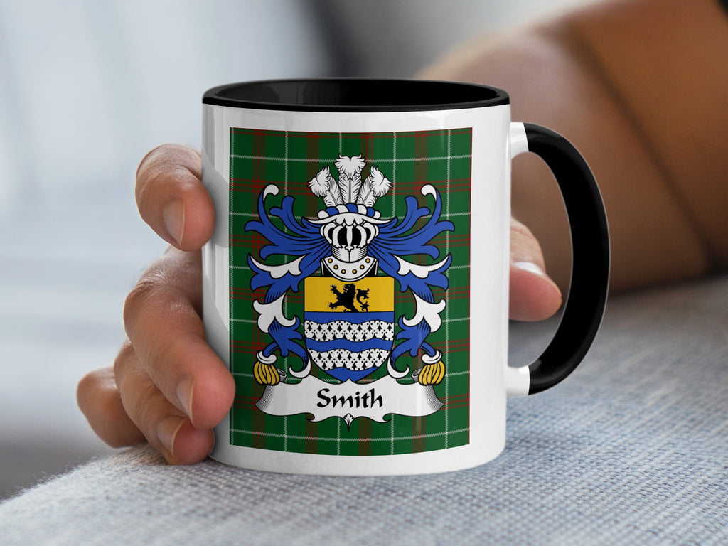 White mug with black handle showing a green tartan and the Smith family crest.