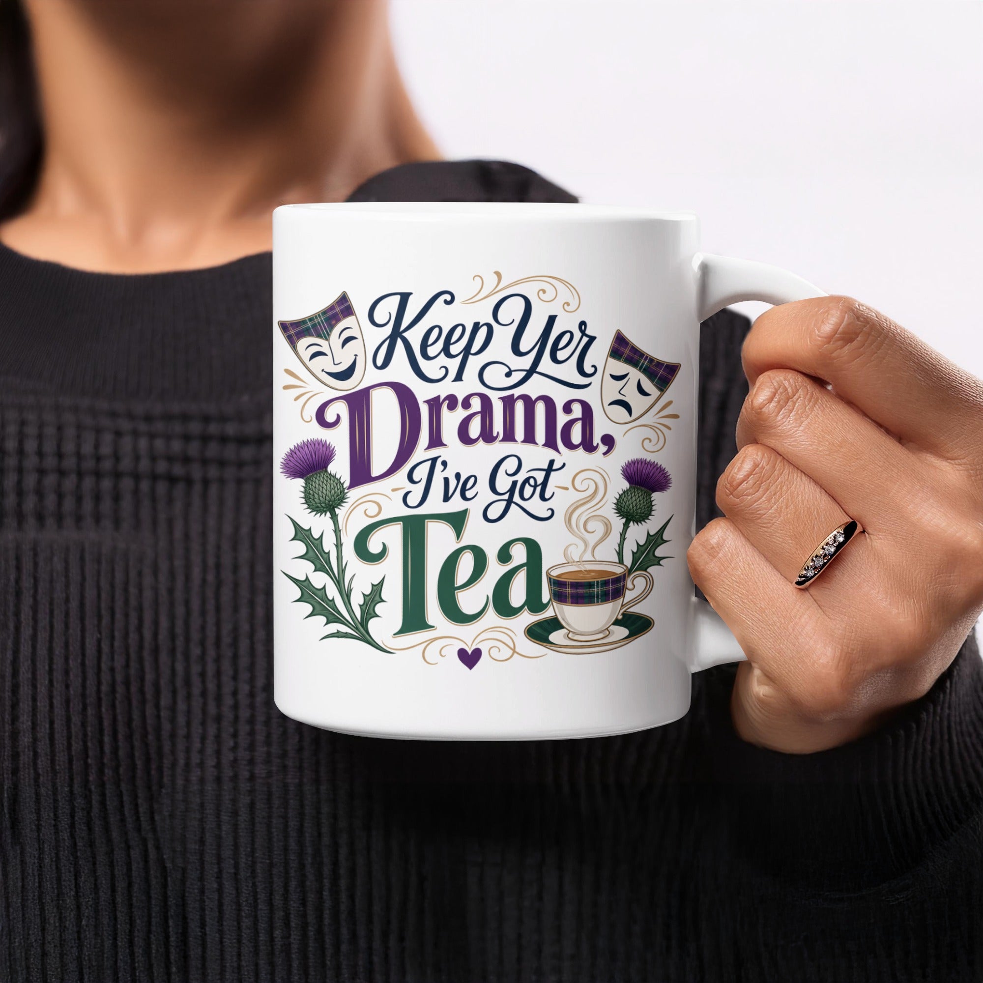 White mug with "Keep Yer Drama, I've Got Tea" text, thistle, and tartan.