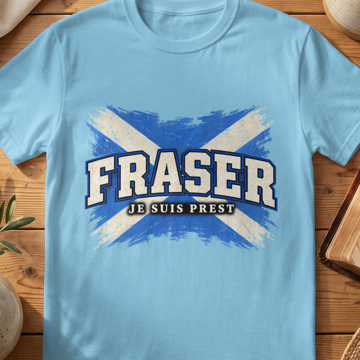 Fraser Scottish Saltire T-shirt in Sky, with distressed blue and cream flag and “Je Suis Prest” lettering.