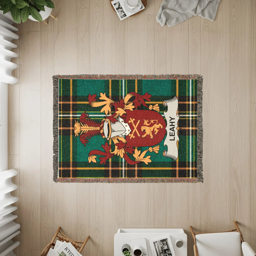 Tapestry featuring the Leahy family crest on a green plaid background.