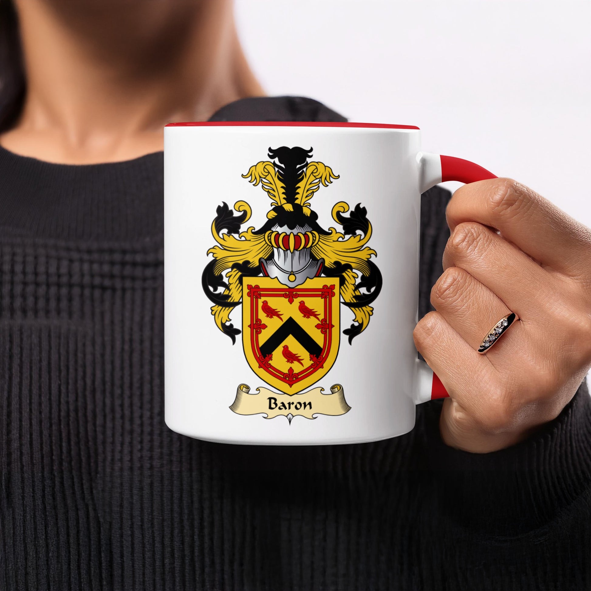 White mug with red rim, featuring a coat of arms with a banner labeled "Baron".