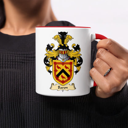 White mug with red rim, featuring a coat of arms with a banner labeled "Baron".