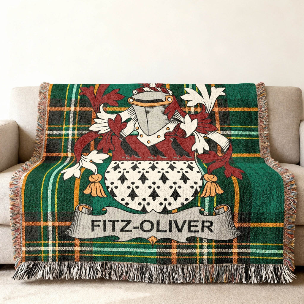 Fitz-Oliver family crest on a green tartan throw blanket.