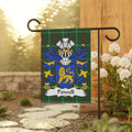 Powell family crest on a green plaid garden flag.