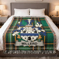 Green tartan blanket with the Miller family crest centered.