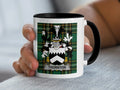 Mug with Thornton family crest on a tartan background.