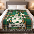 Fitz-Allen family crest on a green and black plaid throw blanket.