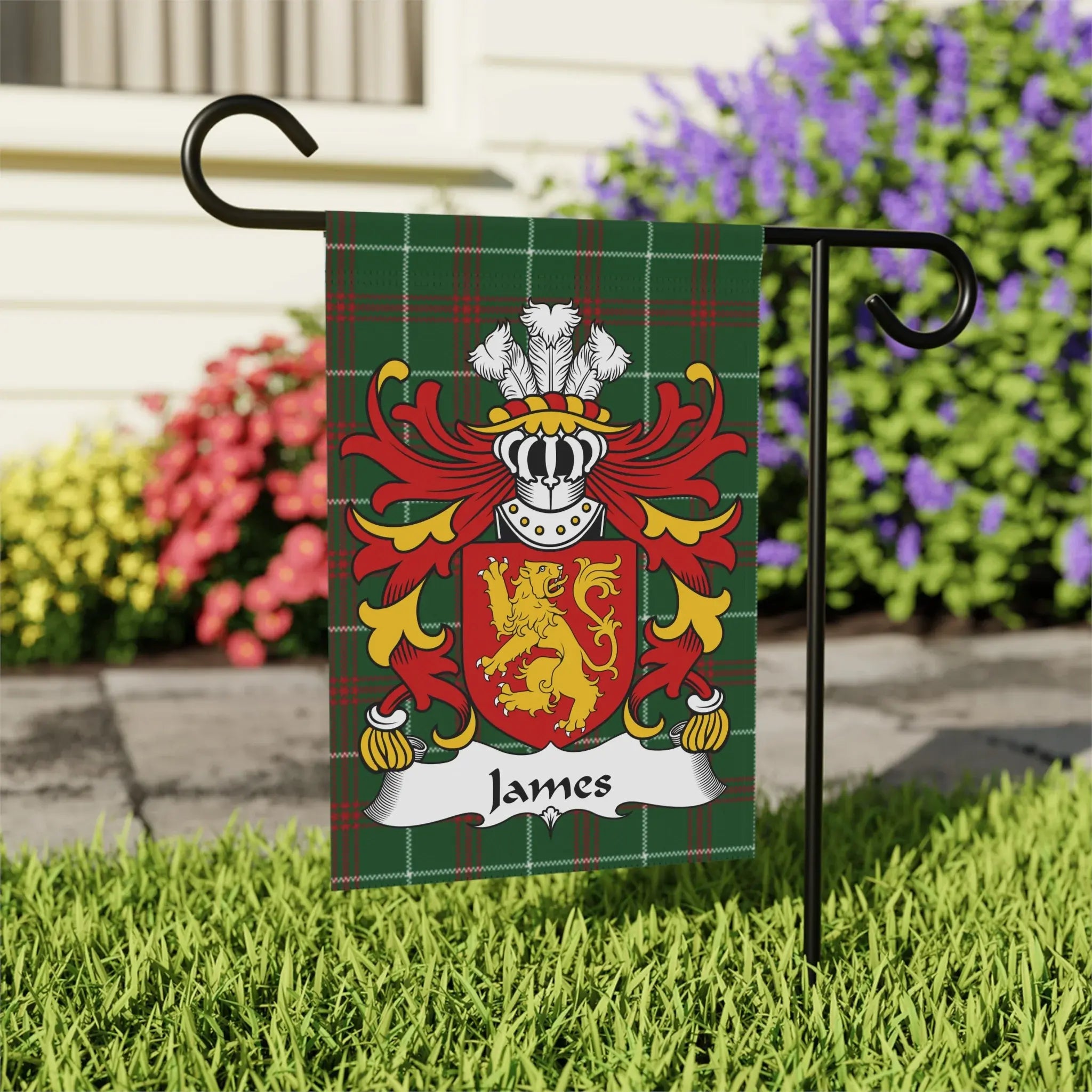 Green plaid garden flag with a red and gold coat of arms and the name "James".