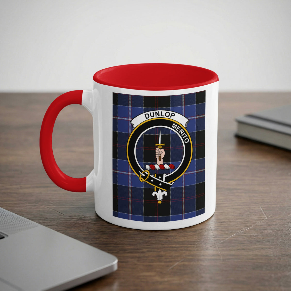 Dunlop Scottish family crest artwork on an 11 oz red accent mug with a tartan background