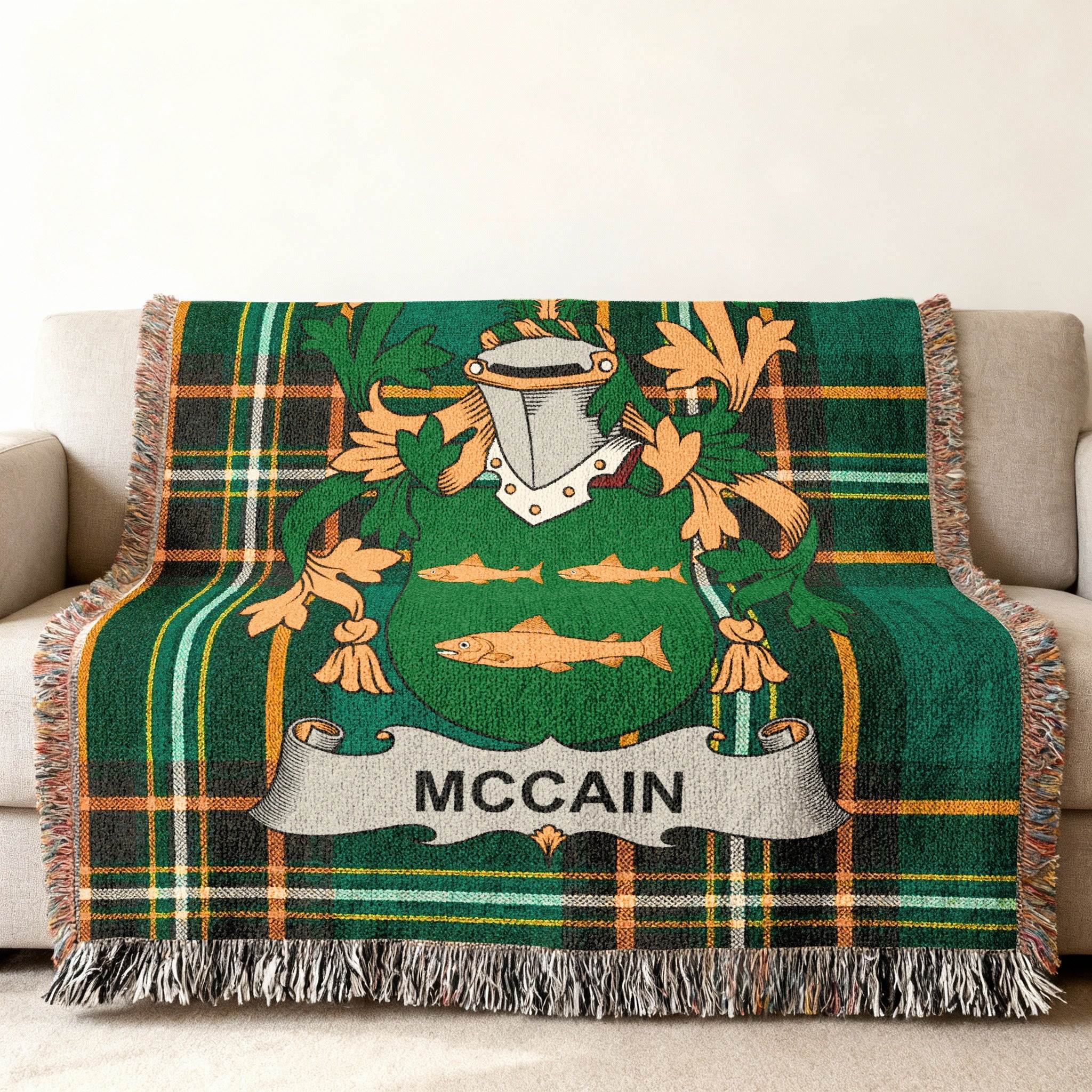 Green plaid throw blanket with the McCain family crest and name.
