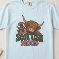 In a Scottish Mood Highland cow design on a Chambray Comfort Colors 1717 T-shirt, flat lay