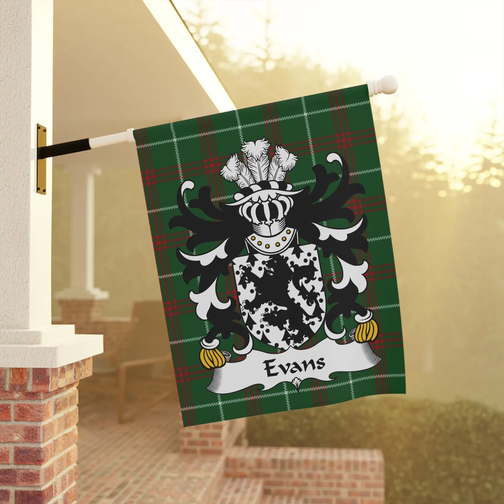 Green plaid flag with a black and white coat of arms featuring the name "Evans."
