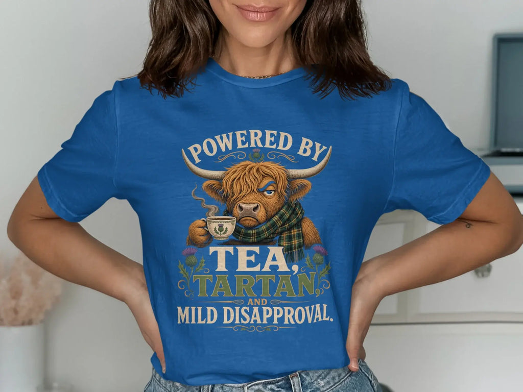Blue t-shirt with Scottish Highland cow graphic and text.