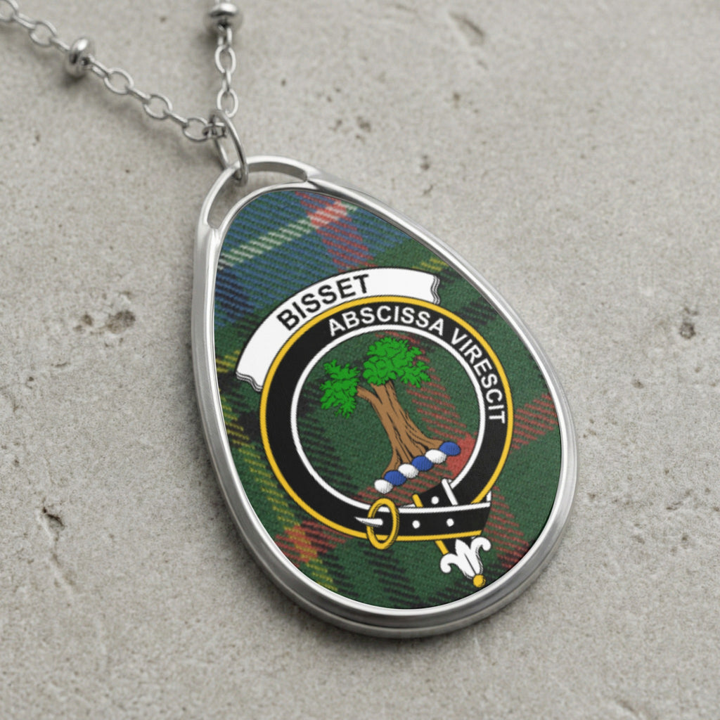 Bisset clan Scottish tartan necklace with clan crest and Abscissa Virescit motto on tartan background